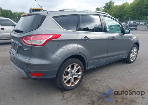 2014 Ford Escape Titanium z USA, uszkodzony, nr VIN 1FMCU9JX2EUC41216